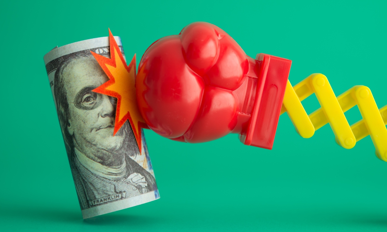 US dollar bill banknote is getting punch in face with fist on green background. Global world economic crisis, US economy recession via inflation, bank run problem, loss investment trading concept.