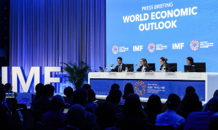 Silvana Tenreyro, Director of the Research Department at the International Monetary Fund (IMF), Petya Koeva-Brooks, Deputy Director of the Research Department at the IMF, and Deniz Igan, Division Chief of the Research Department at the IMF, speak to the media during the World Economic Outlook at the 2026 Annual Meetings of the International Monetary Fund (IMF) and the World Bank Group at the Queen Sirikit National Convention Center in Bangkok, Thailand, on October 13, 2026. (Photo by Anusak Laowilas/NurPhoto)