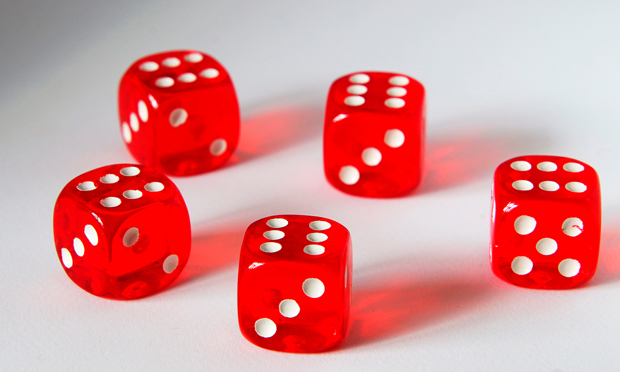 five red dice on a white background, dropped to all sixes