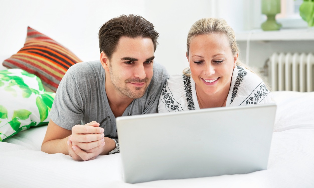 Man and woman by computer